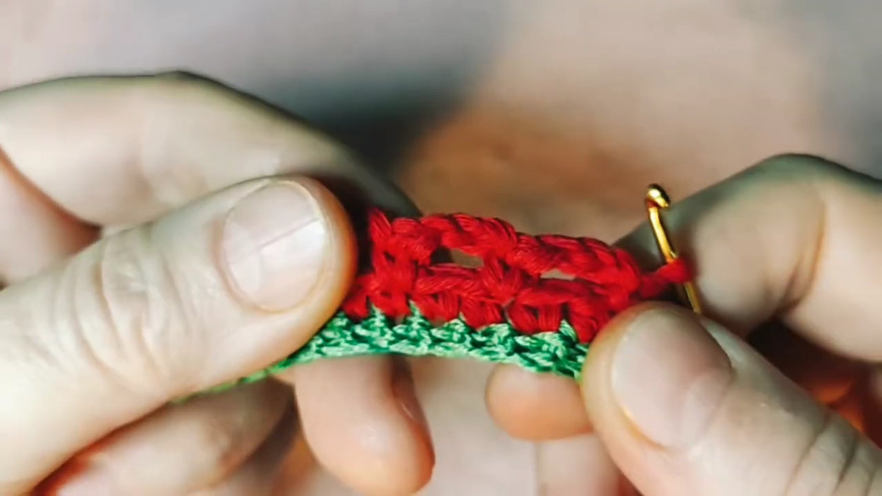 Chaining and single crocheting Row 3 to build the picot edge.