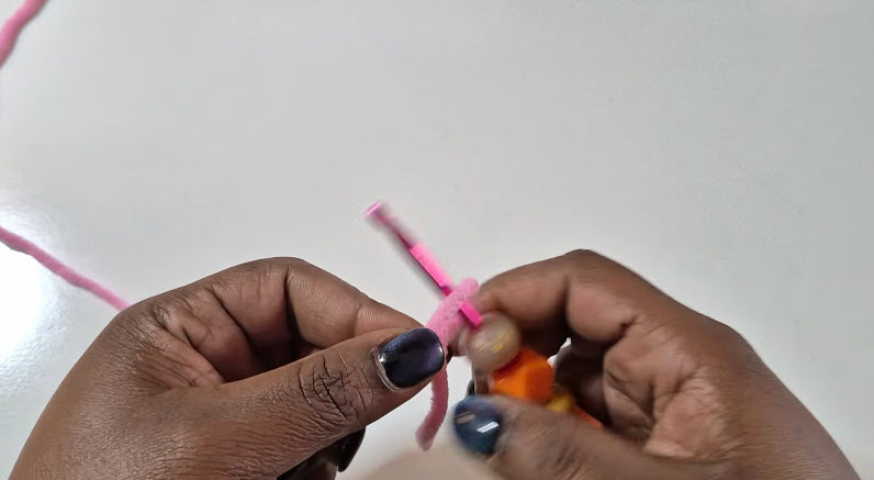 Chaining foundation with pink crochet yarn