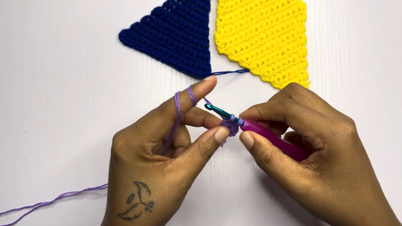 Foundation chain in purple yarn with hook