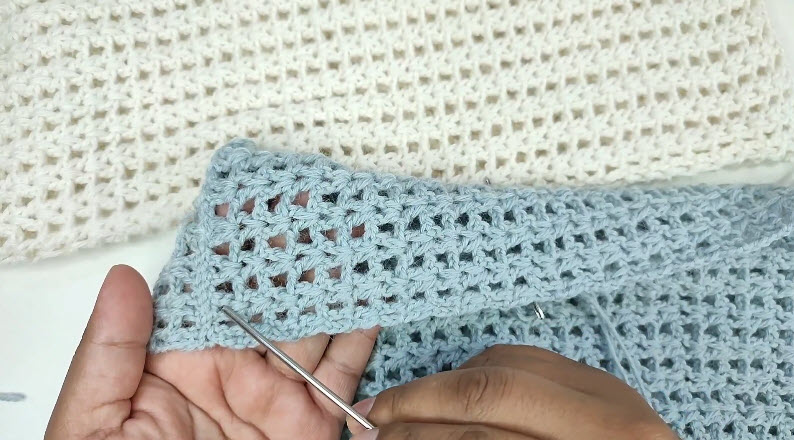 Joining white and blue crochet panels for sweater