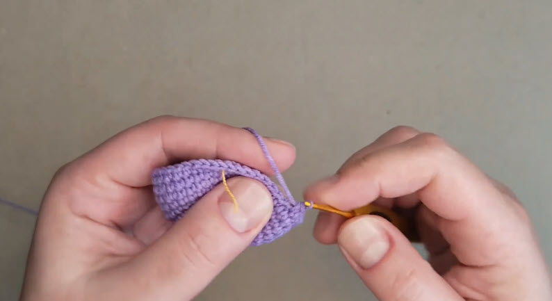 Purple piece at 48 stitches with a yellow marker thread.