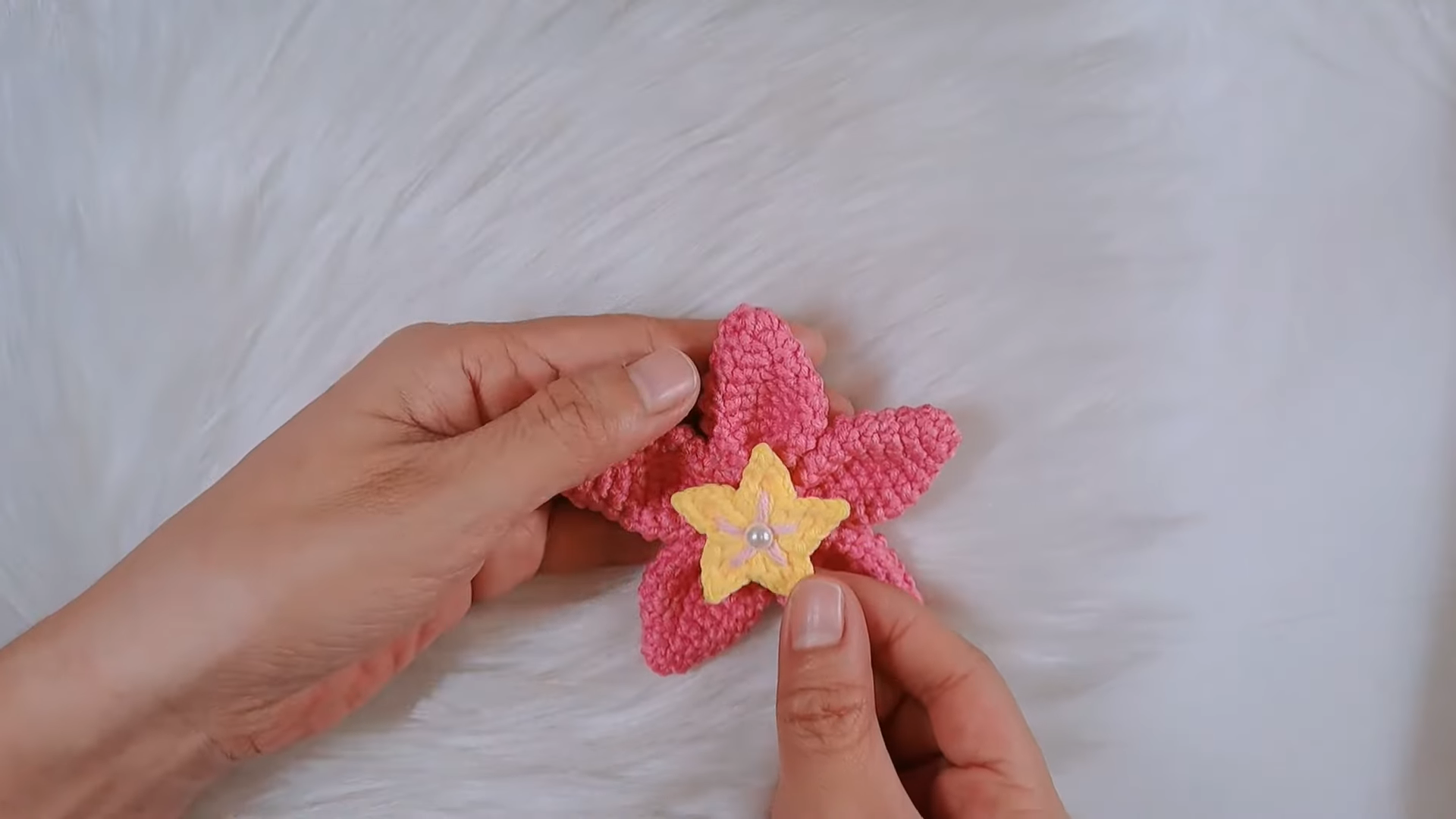 Pink and yellow crochet flower keychain with pearl