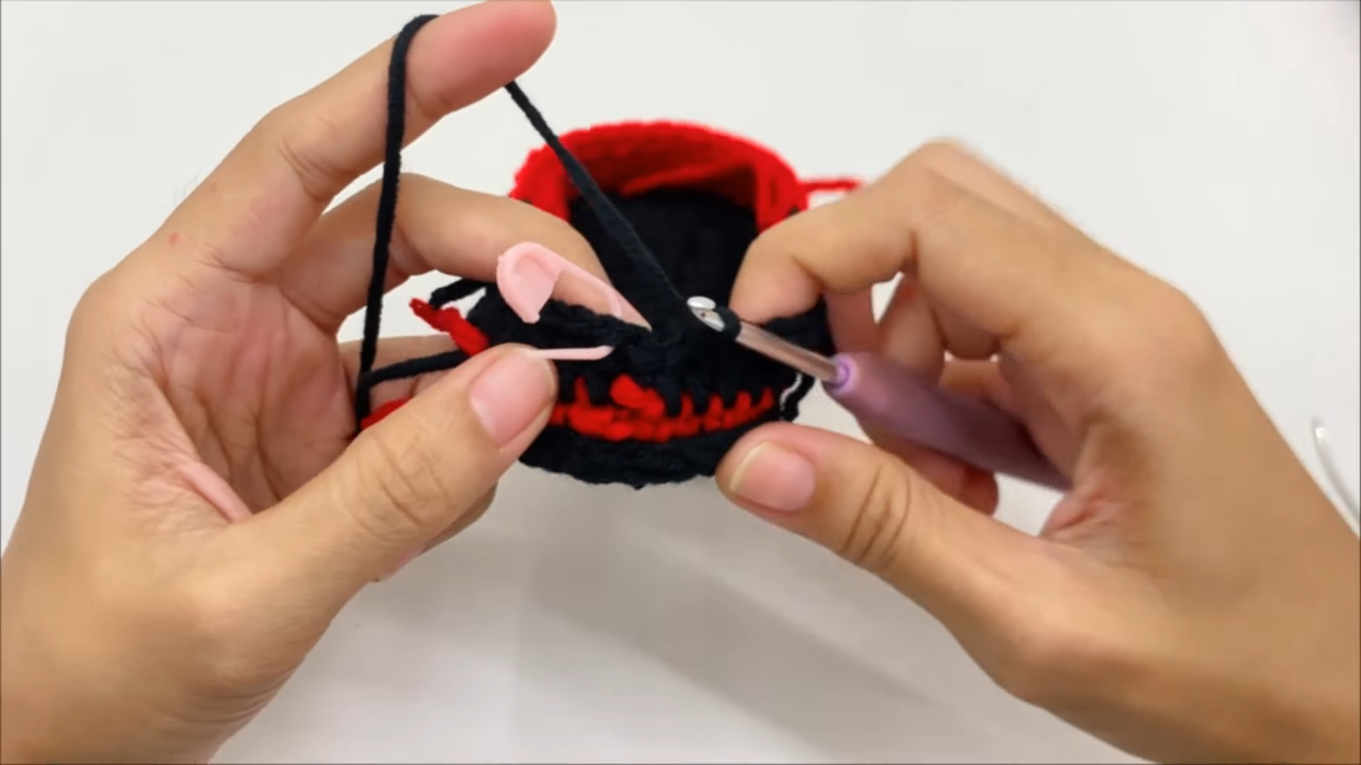 Red black crochet motocross baby bootie shape
