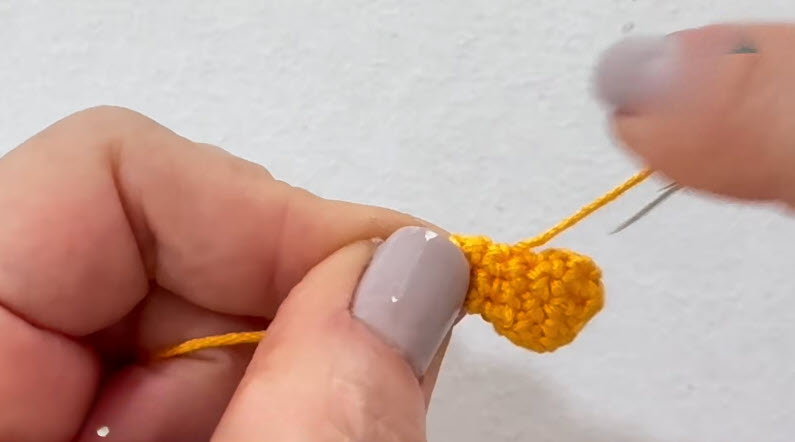 Small yellow crochet piece for amigurumi duck