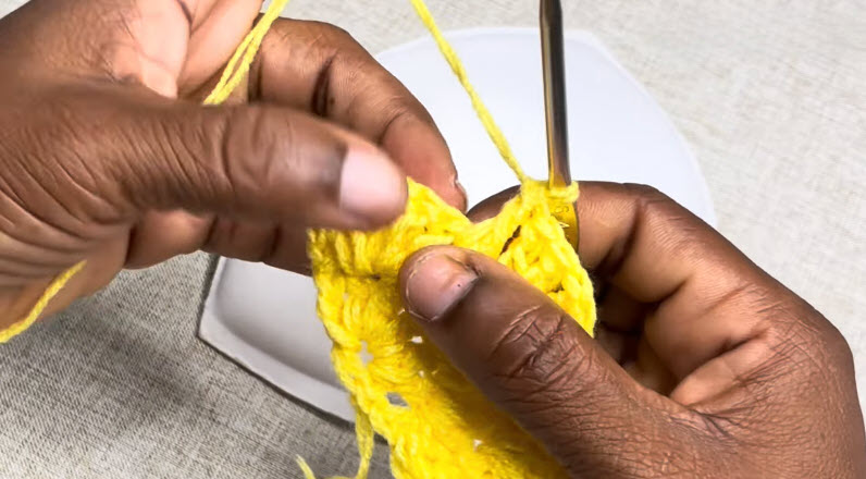 Yellow crochet stitches worked in rows