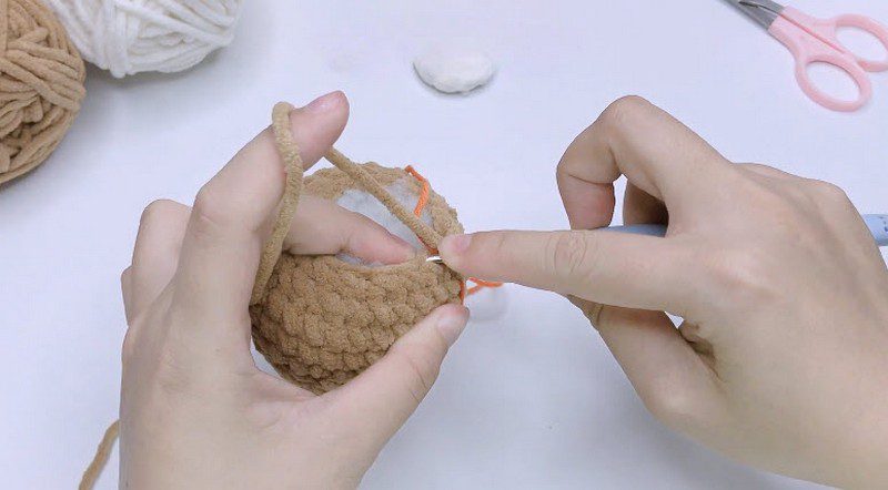 Decrease the head rounds and add stuffing.
