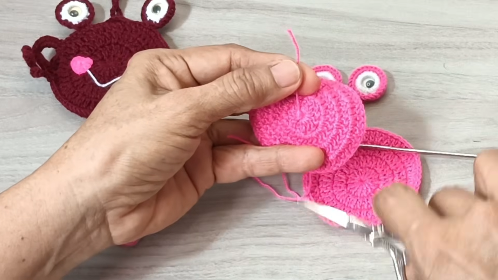 Placing the eyes and side loops beside the pink body.