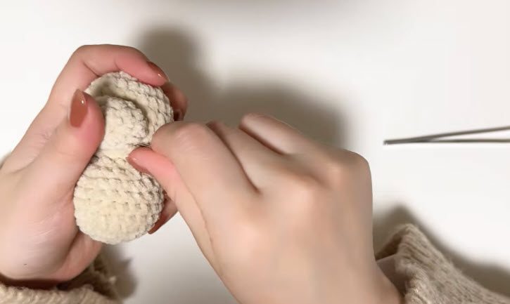 Stuffed pieces pressed firmly and stitched in place